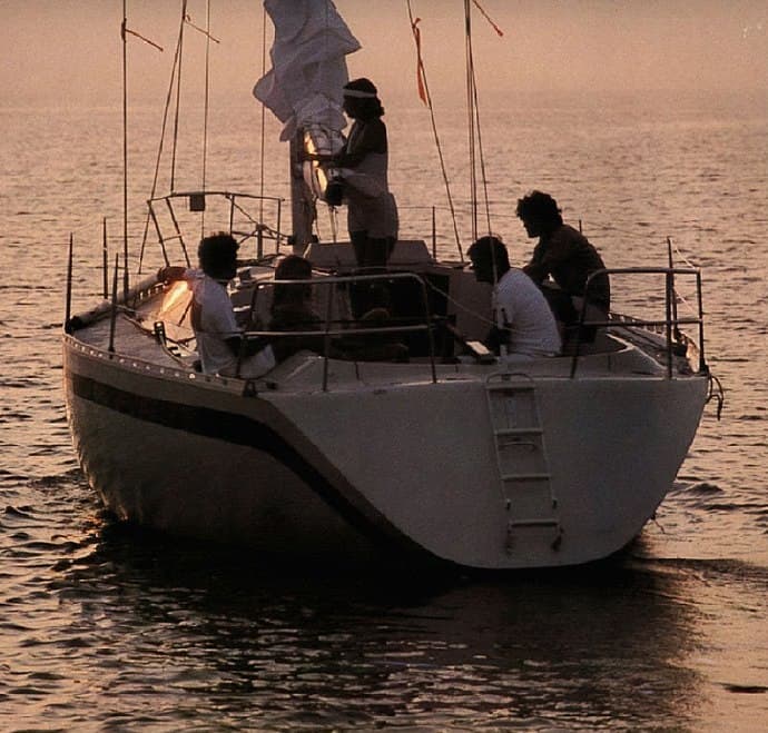 Putting away sails at dusk
