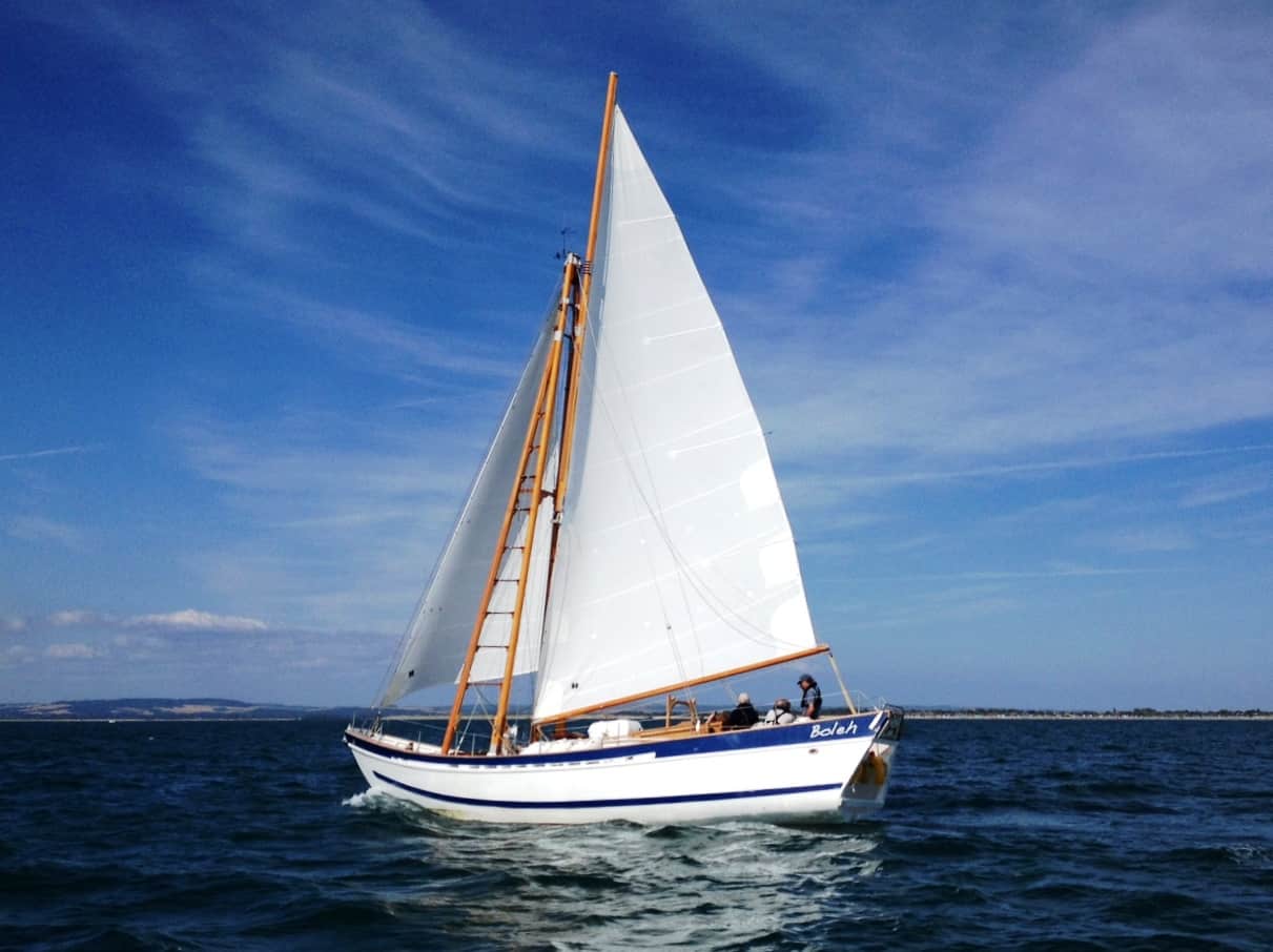 A classic yacht sailing on delivery