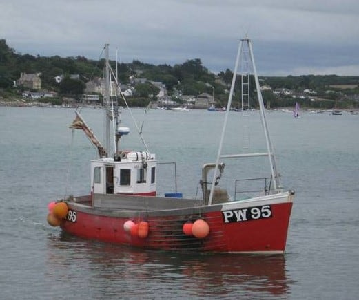 A Cornish Fishing Vessel motoring out from Padstow on delivery to Wales