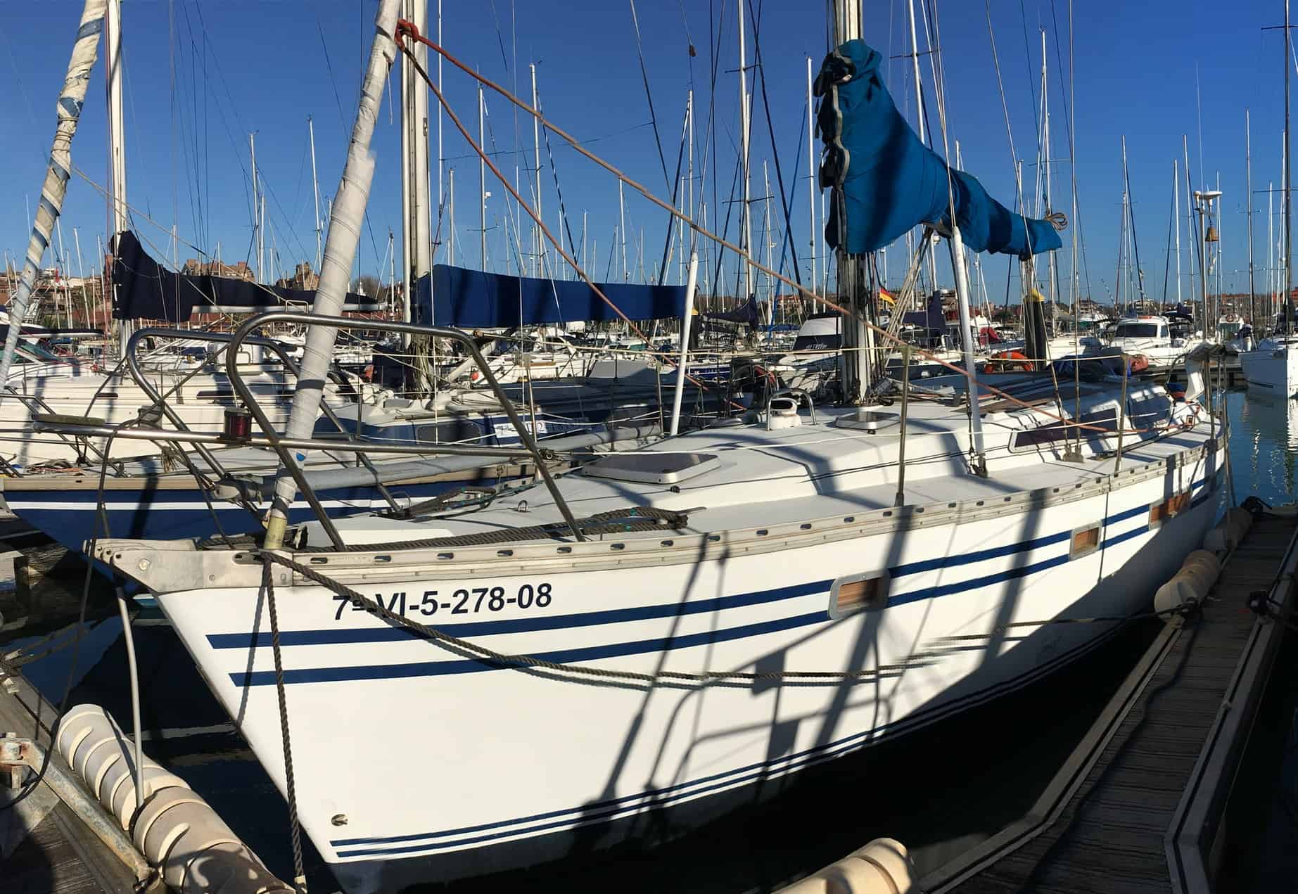 A Jeanneau Voyage Yacht moored in a marina ready for delivery.