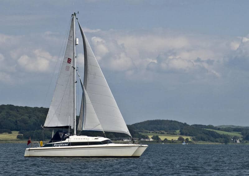 A Prout Snowgoose catamaran sailing on a yacht delivery to the Solent.