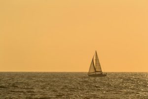yacht sailing across the horizon