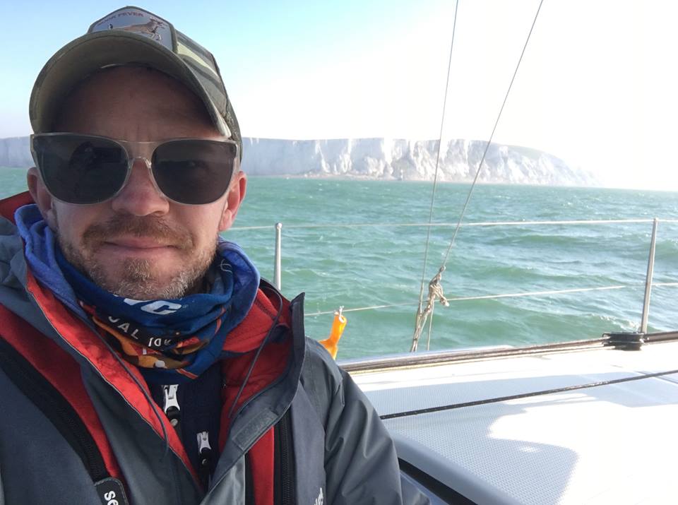 Yacht delivery crew sailing passed the white cliffs of Dover