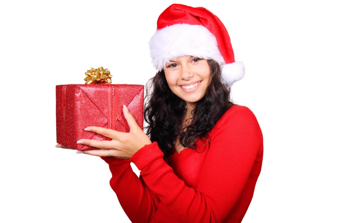A pretty girl holding a present