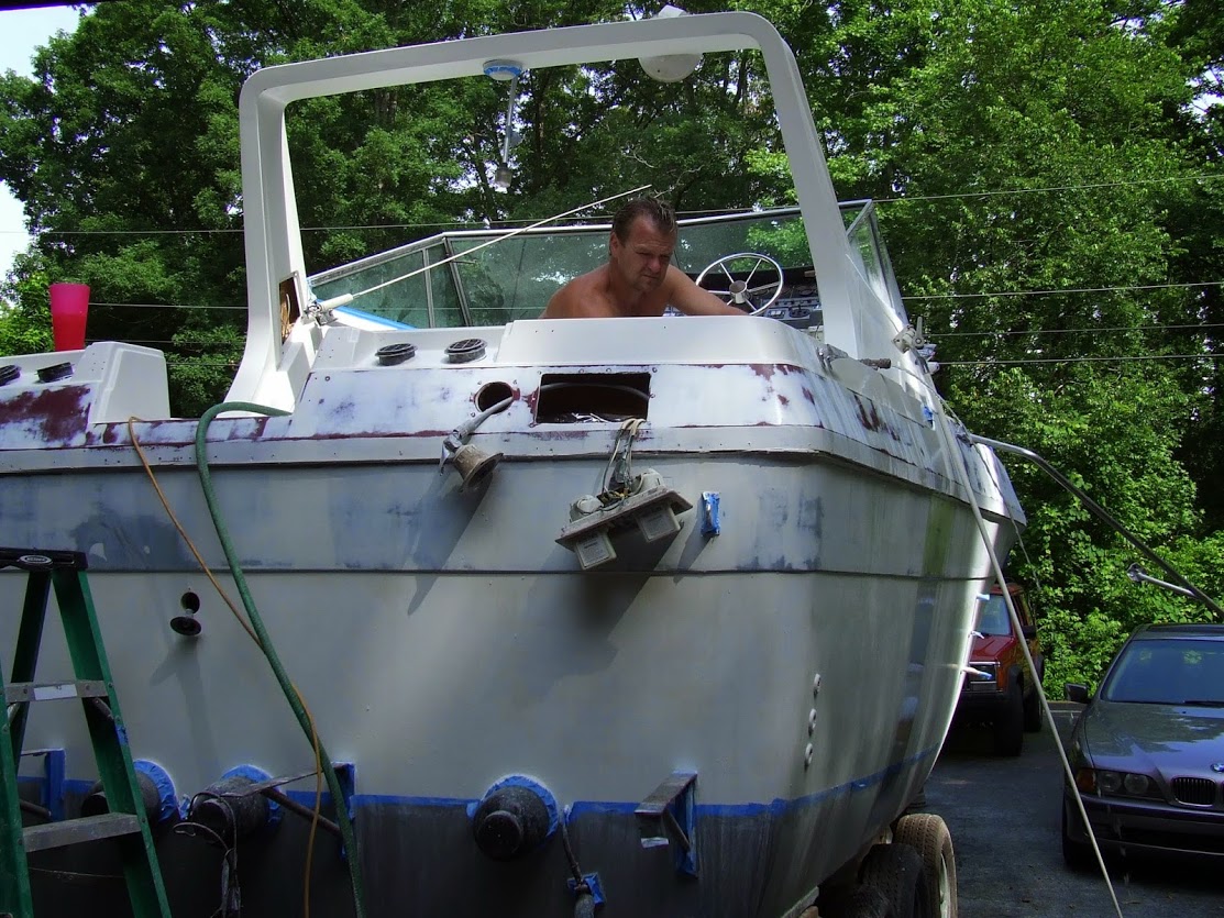 Tim Griffin restoring a boat