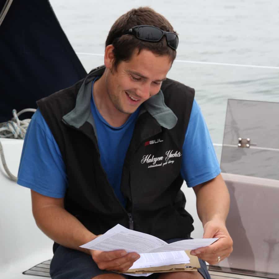 yacht delivery skipper reading some notes