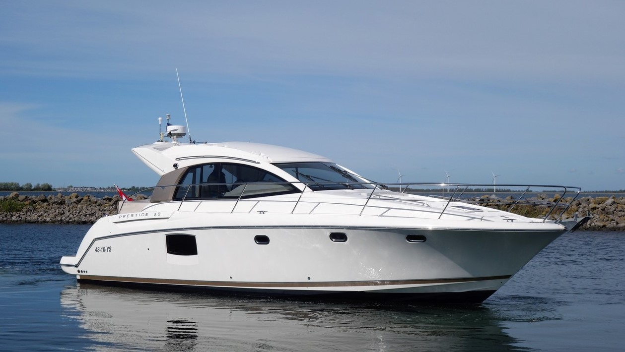Jeanneau Prestige 38s powerboat heading out of the marina on delivery to Torquay.