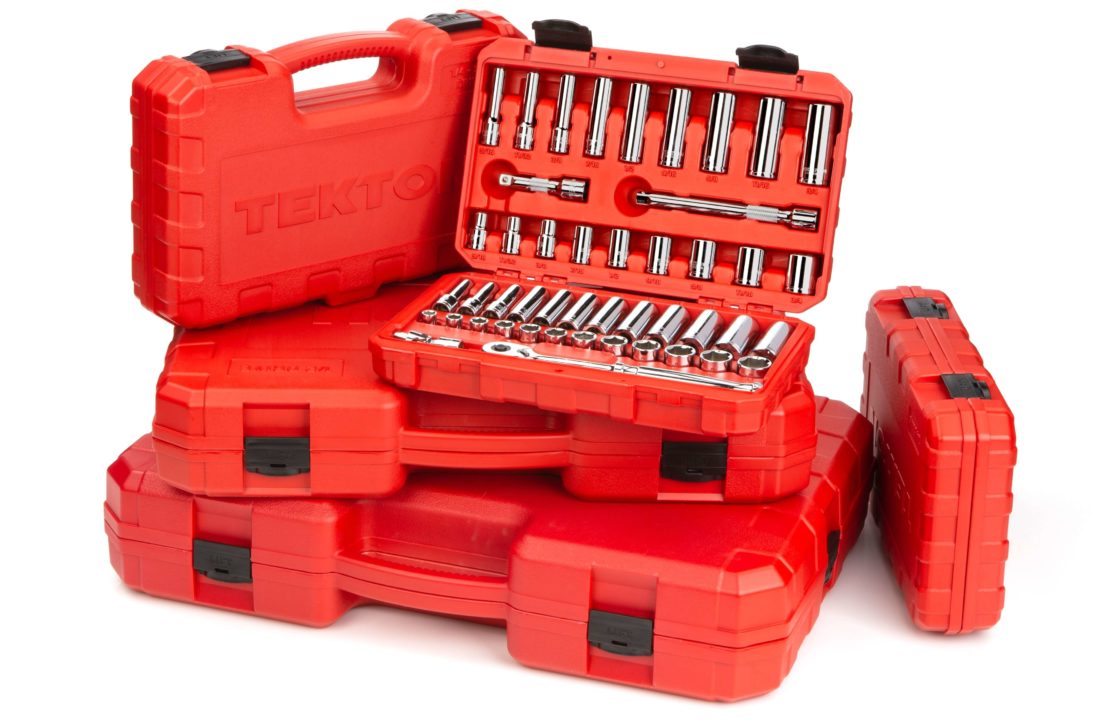 Red boxes of tools stacked together.