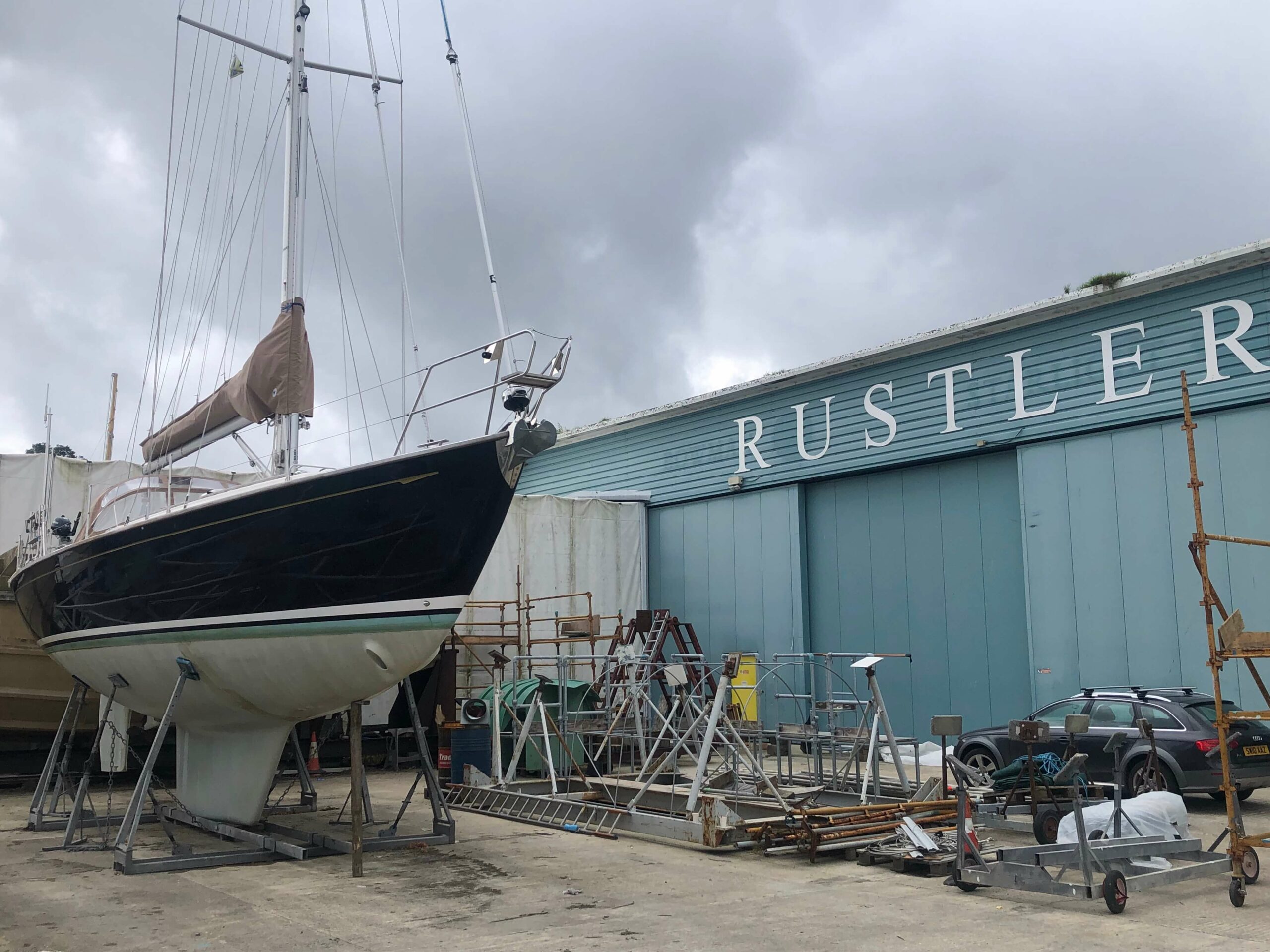 Rustler Yachts yard in Falmouth with a Rustler 42 sitting in a cradle outside
