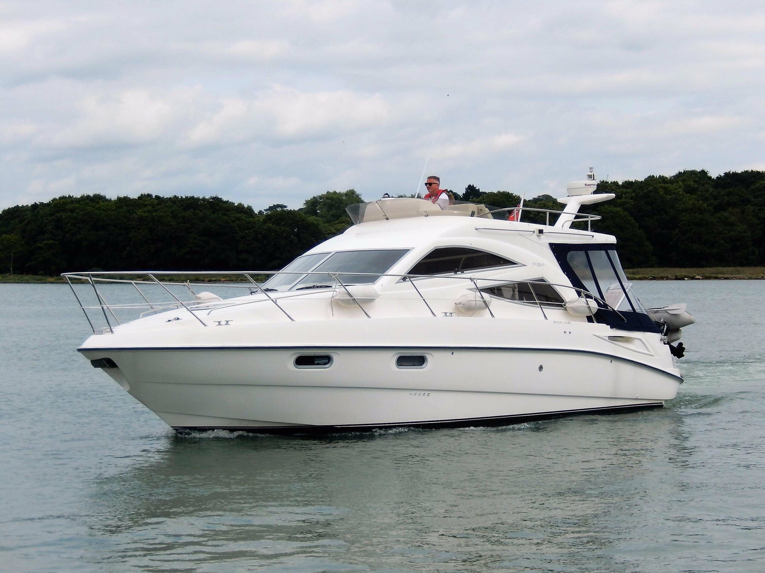 Sealine F34 powerboat cruising on delivery to Jersey