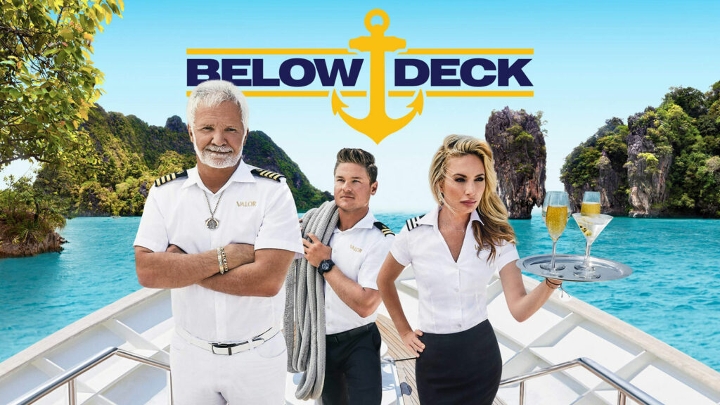 Below Deck cover photo with 3 crew on the bow of a superyacht