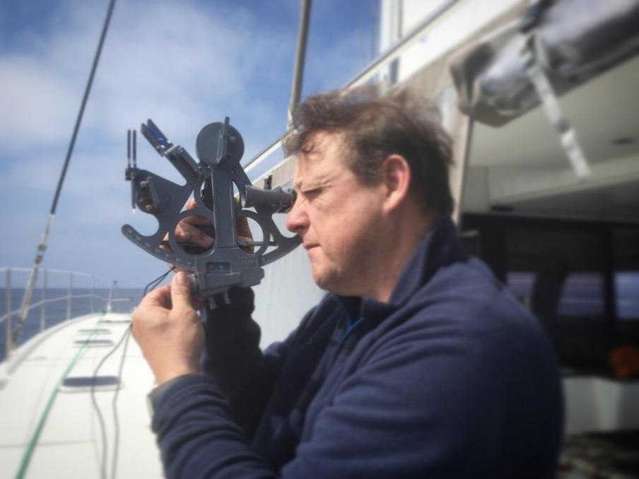 Man using a sextant